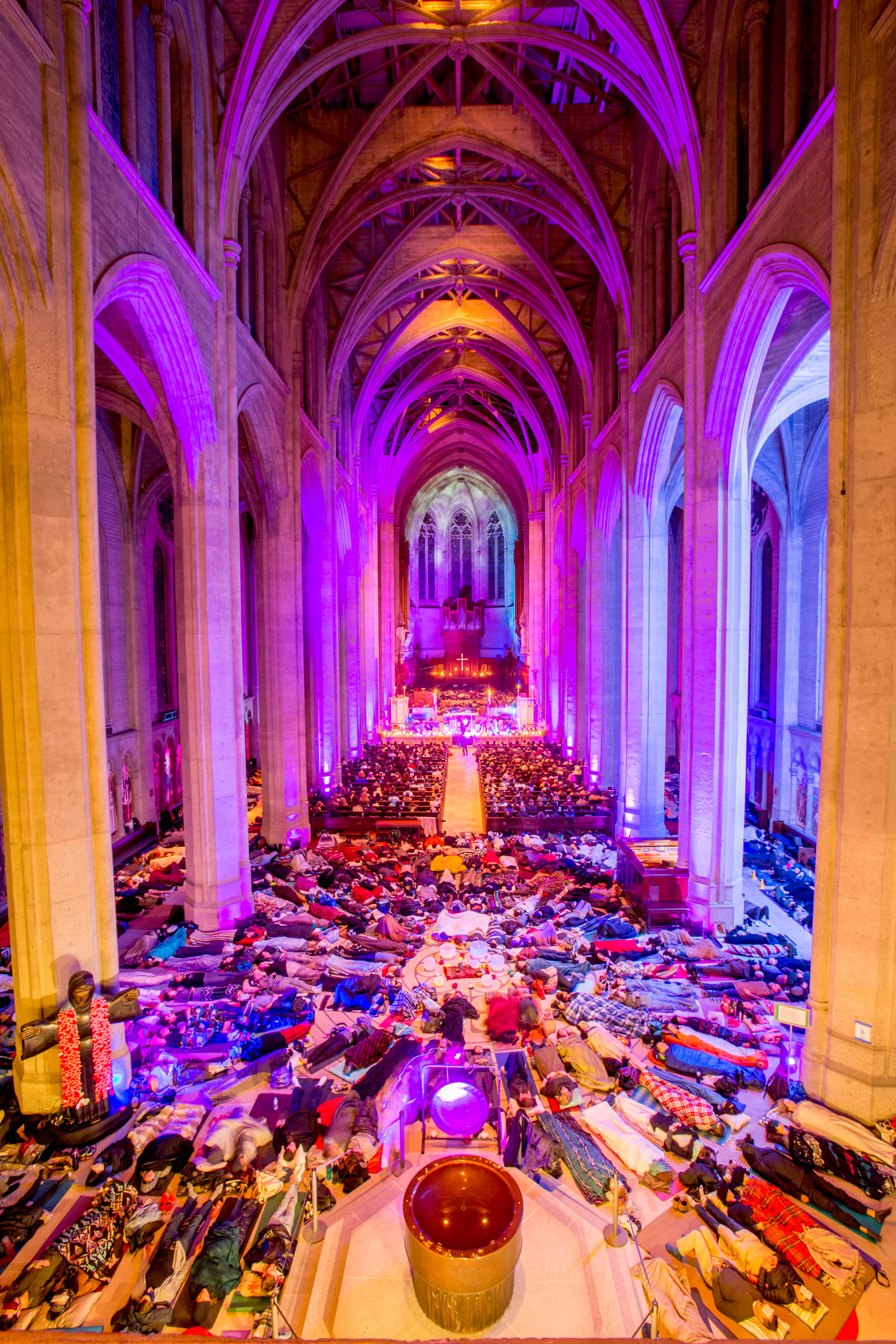 Sound bath event attendees lying down inside Grace Cathedral