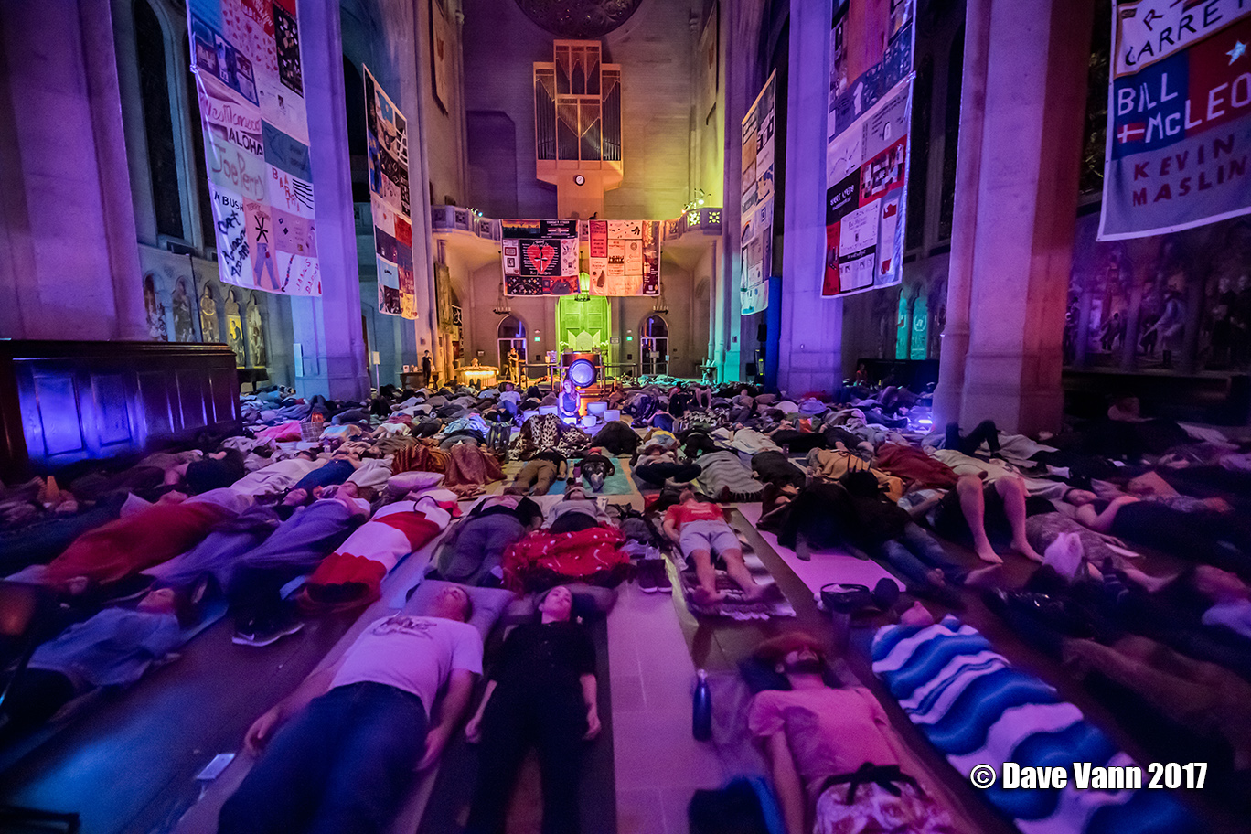 People lying on mats in Grace Cathedral for a sound bath