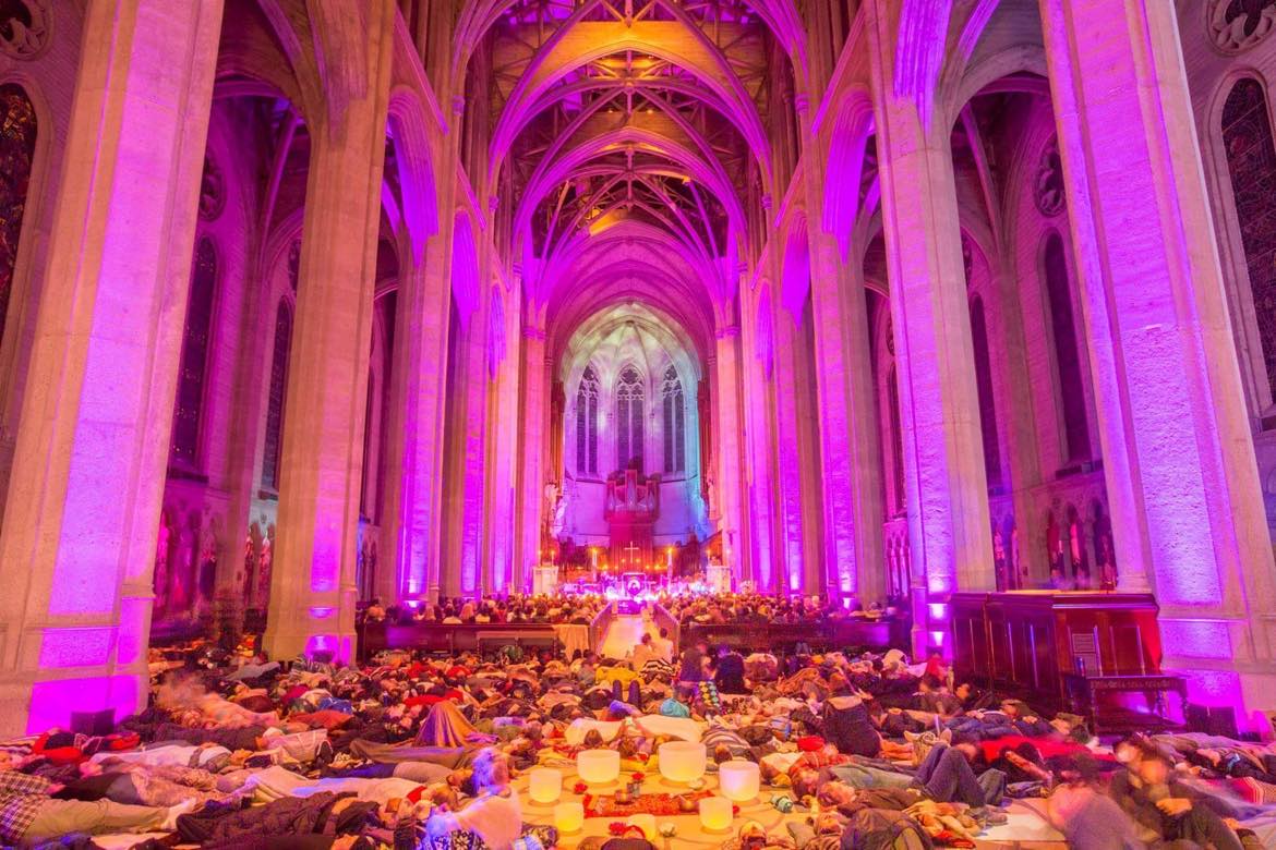 Participants lying on the floor during a sound bath in Grace Cathedral