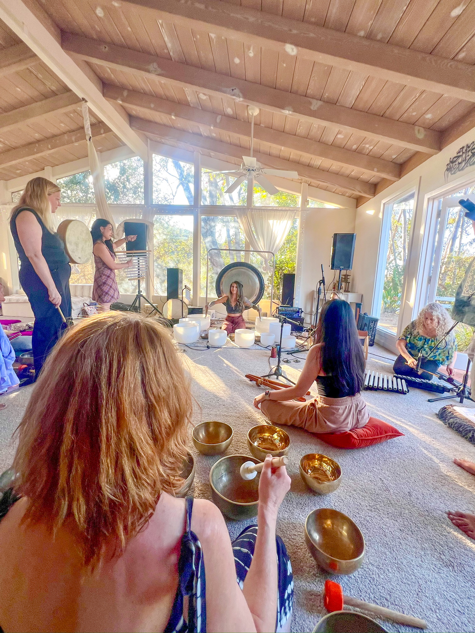 A sound bath training session with singing bowls